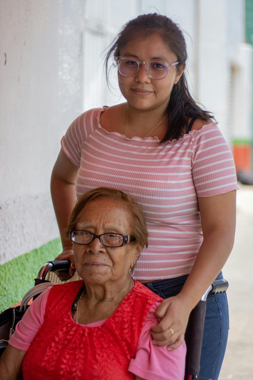 Carer supporting a client at home during a visit